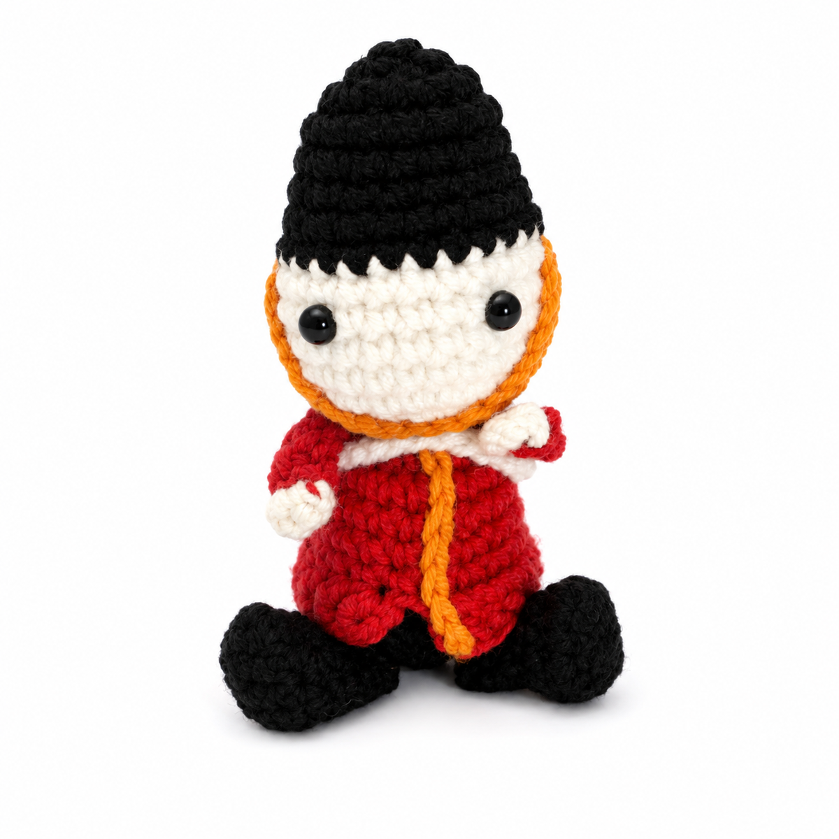 Crochet British King's Guard character on white background